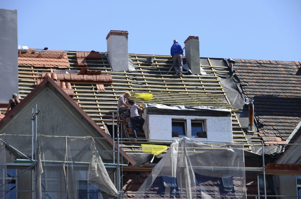 Roof repair - laying tiles